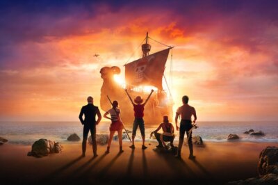 Das Poster der neuen Netflix Live Action Verfilmung des berühmten Anime "One Piece". Die Strohut-Bande steht mit dem Rücken zur Kamera und blickt auf ihr Schiff, die Flying Merry.